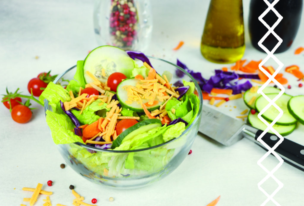 Bowl with green leaf lettuce, cabbage, carrots and the salad fixings with Vevan Shred